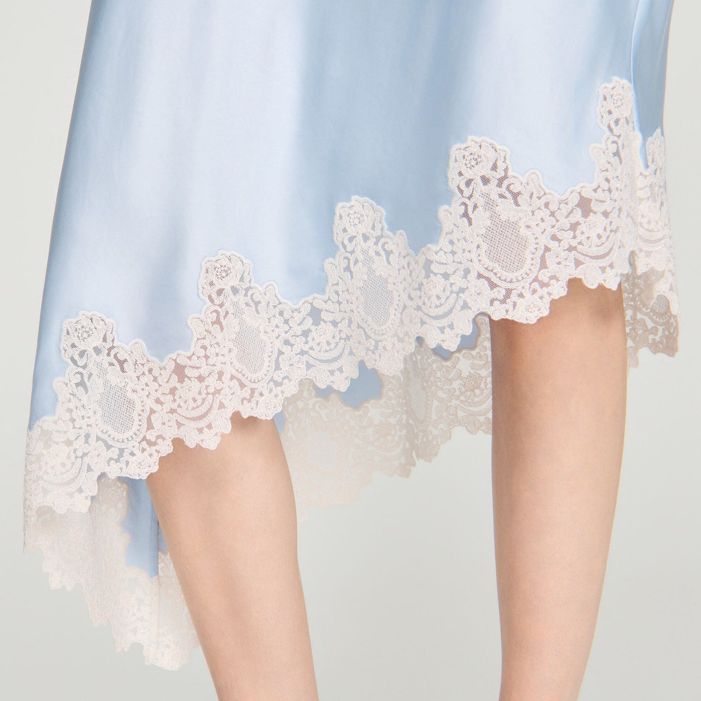 Asymmetrical satin skirt with lace