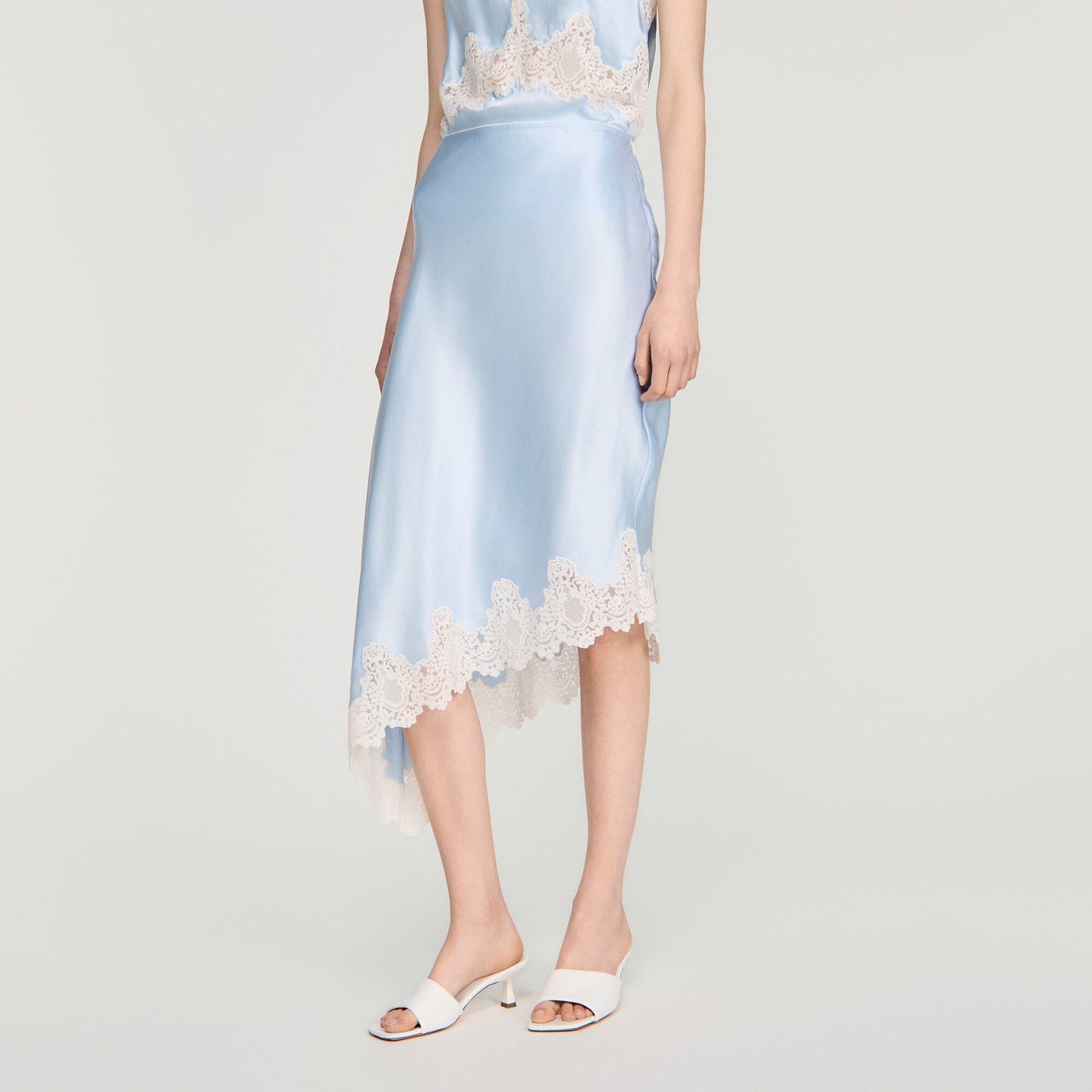 Asymmetrical satin skirt with lace