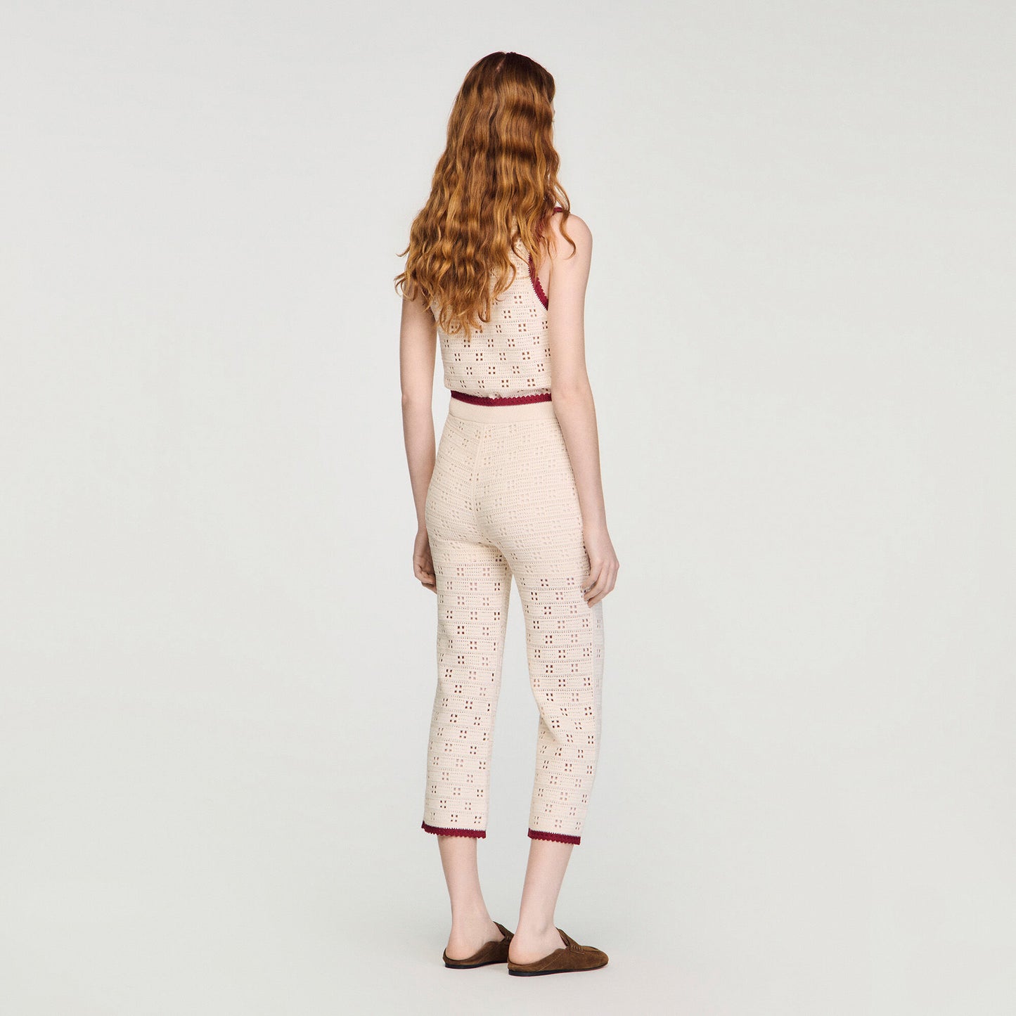 Crochet-look knit trousers